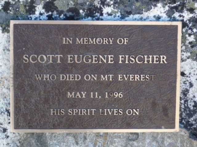 The team buries Fischer above the South Col as the team regroups.