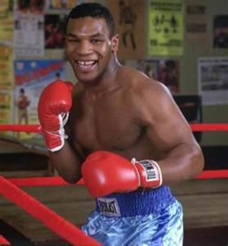 Mike Tyson wins his first title