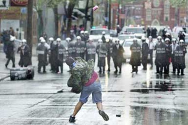 Race riots in Cincinnati continue for several days following a shooting of an unarmed black man by a white police office