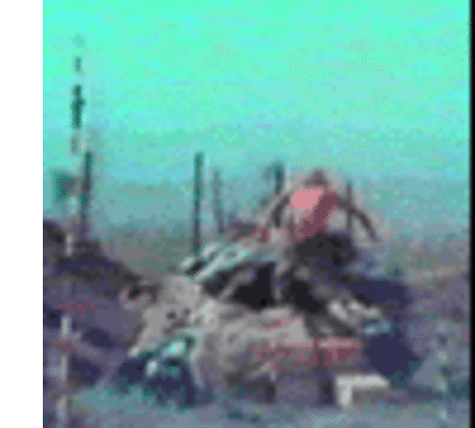 An American soldier leaps into a bunker during a Vietcong assault