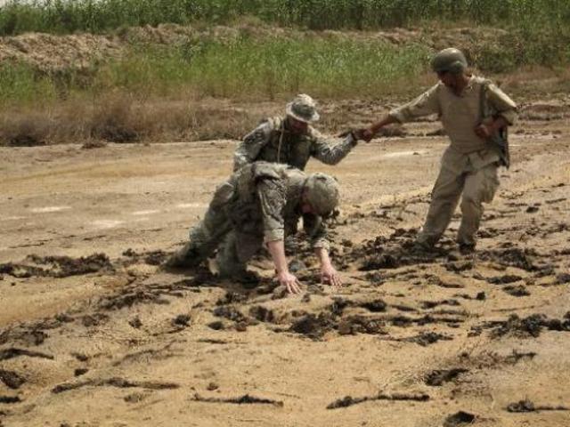 Kiowa sinks in a feild of waste