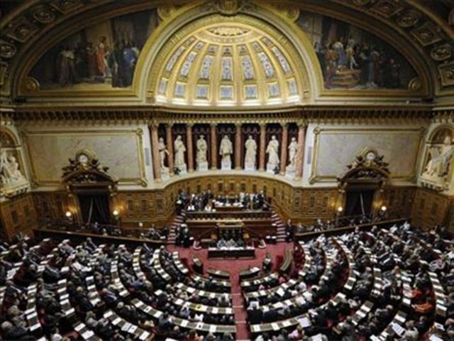 Facial covering ban is approved by French Senate.