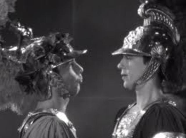 Demetrius and Lysander fight over Helena, while Hermia and Helena have a cat fight