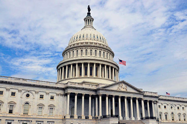 U.S. Senators leave the house