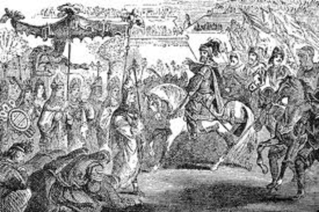 Hernan Cortes and Montezuma, the ruler of the Aztecs, meet.