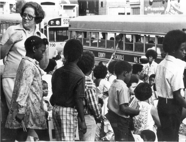 Aiding desegregation through busses