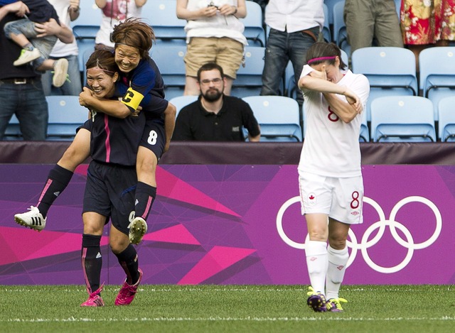 Women's soccer team loses opener to Japan, 2-1. Canadian central defender Candace Chapman leaves the game with a leg injury.