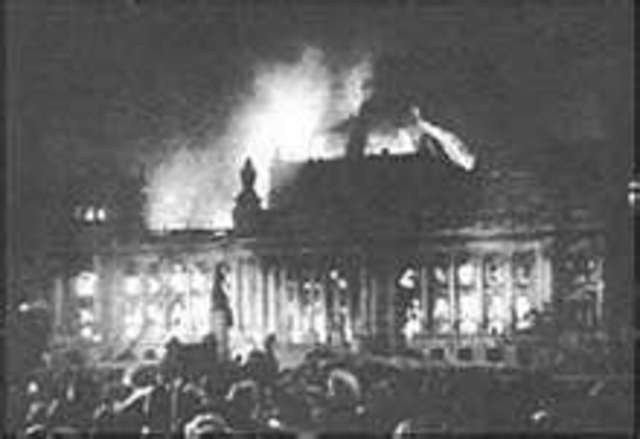 Fire partly destroys the Reichstag building.  The government takes the occasion to step up persecution of the opposition parties.