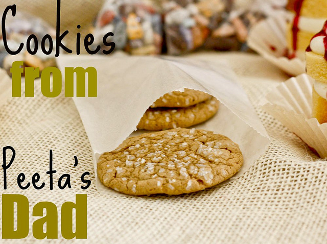 Peeta’s dad helps Katniss by giving her cookies