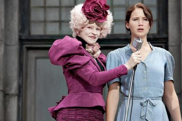 Effie helps Katniss learn more manners for her interview