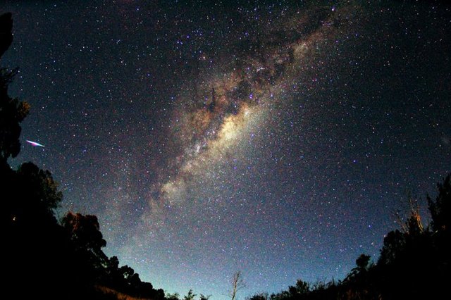 Galileo observes the Milky Way through his telescope.