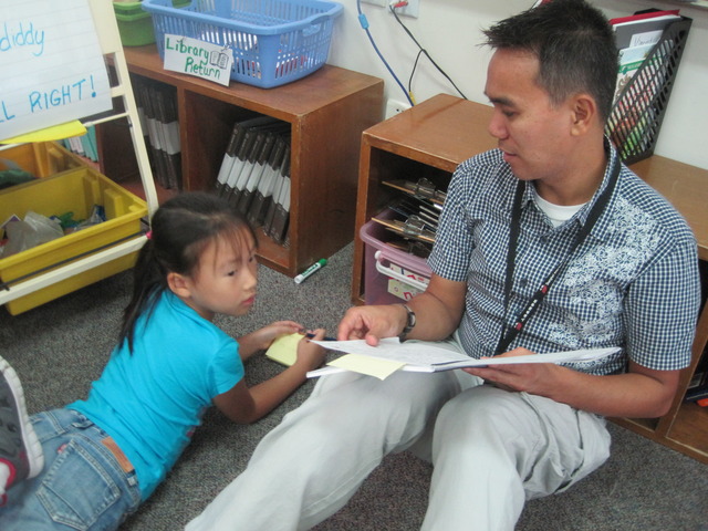 Mr.Mike helping in writing