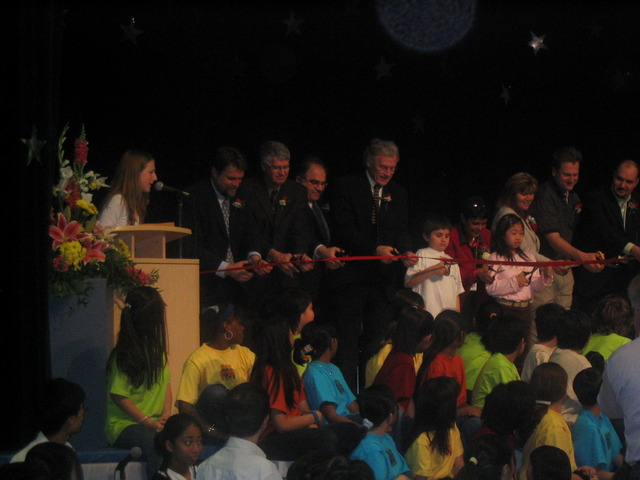 Cut Ribbon at Official School Opening Ceremony