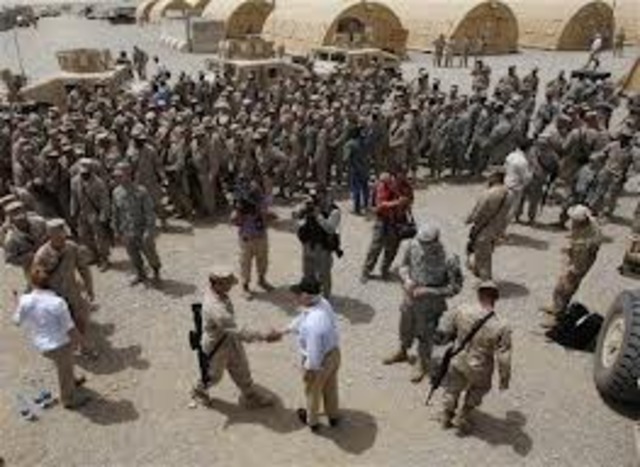 George Bush orders a troop surge