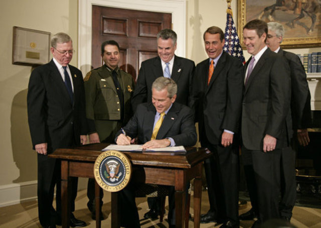 Pesident Bush signs the secure fence act of 2006