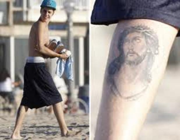 justin gets a jesus tattoo