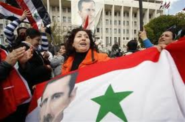 Assad sacks cabinet, hints at reform