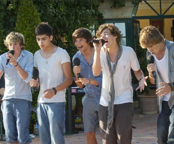 One direction goes through the live shows and the judges house.