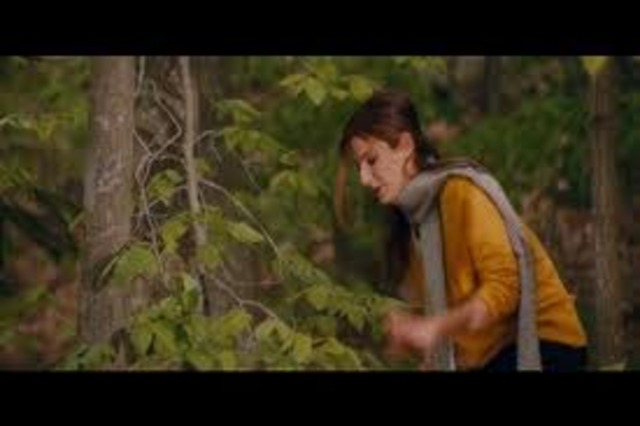 Margaret goes for a ride on a bike in the woods to clear her head