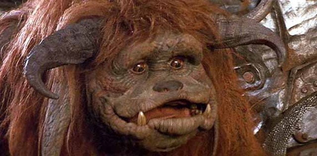 Sarah encounters a gentle beast named ludo, who is being tormented by goblins, who sarah scares off