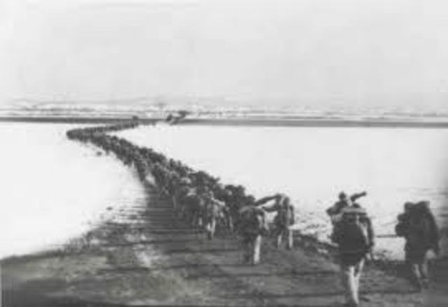Chinese Communist troops cross Yalu River into Korea