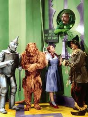 They all run away, but Dorothy, Scarecrow, Toto,Tin-Man and the Lion run towards where the wizard is.