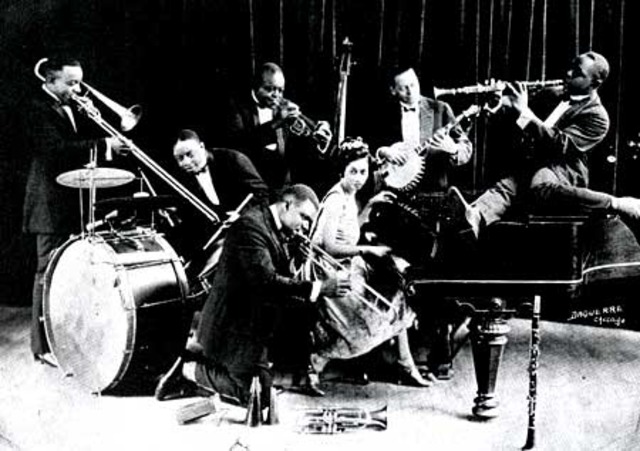 Louis Armstrong plays for King Oliver's Creole Jazz Band in Chacago