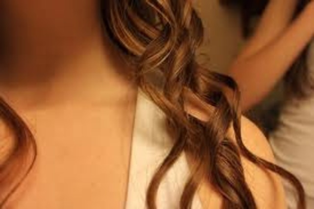 Curling your hair with a hair straightner...