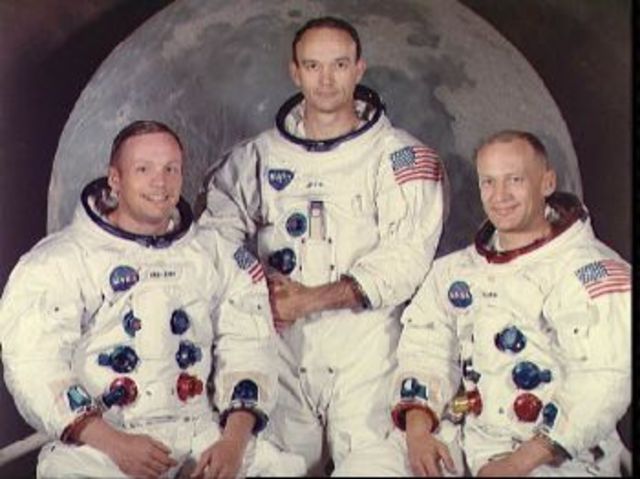 Neil Armstrong and Buzz Aldrin, become the first men to walk on the moon