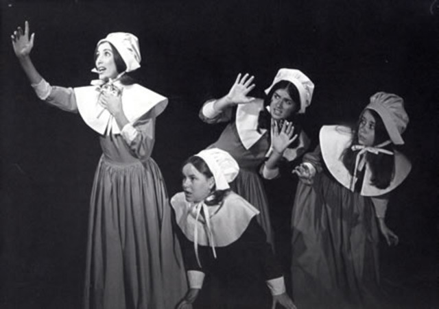 The girls in the circle begin to act very strangley and ill