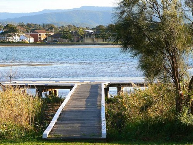 Gatsby is still inlove with Daisy when he comes back from the war, so he moves close to her.