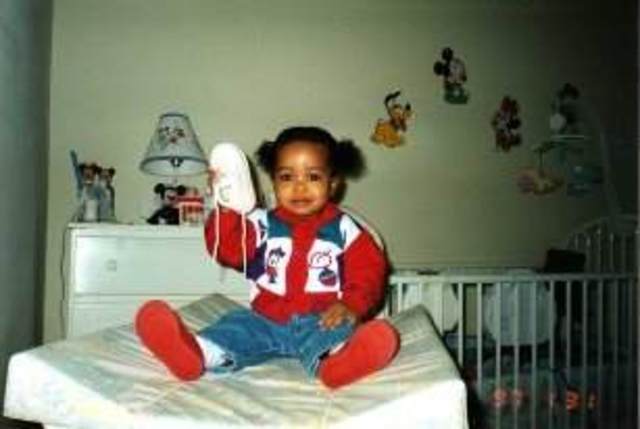 2 months away from being a year old.  More hair growth, and able to sit up on my own; Biological