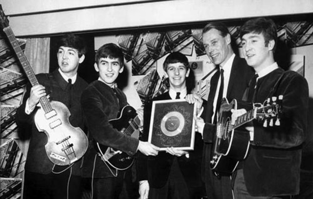 The Beatles sign with George Martin