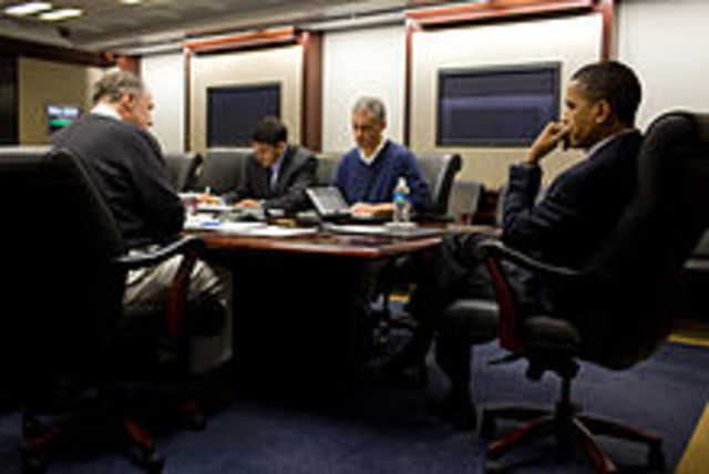Obama is briefed on the earthquake in Chile.