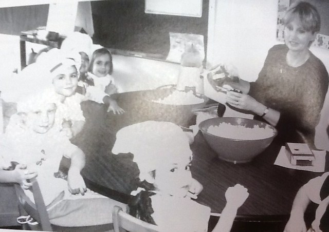 Mrs. Price cooks with students.