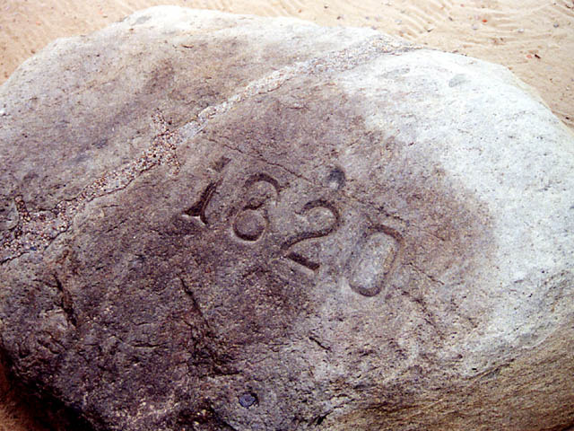 Pilgrims land at Plymouth Rock