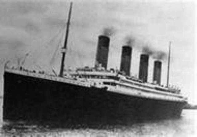 The Titanic sails through calm waters.