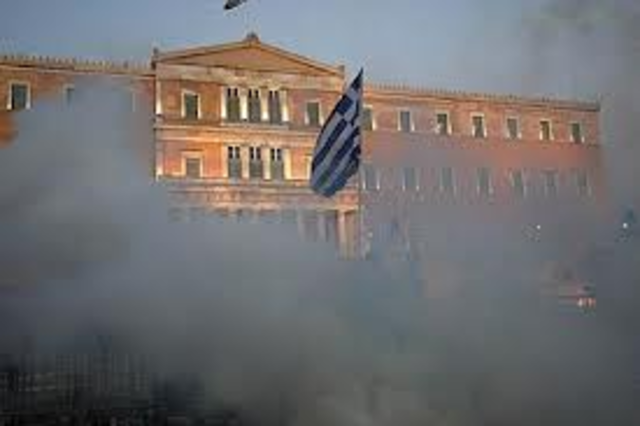 Students attack police outside the parliament building and tear gas used against protesters.