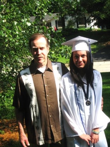 High School graduation ceremony. Here I am with my grandpa before the ceremony.