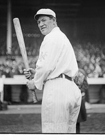 Starts playing professional baseball