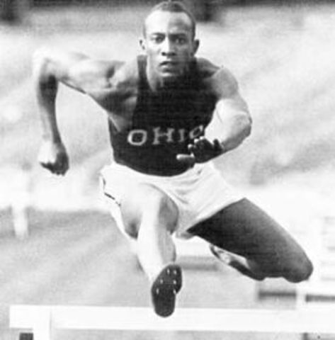 Jessie Owens wins four gold medals at Berlin Olympics