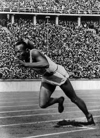 Jessie Owens wins four gold medals at Berlin Olympics