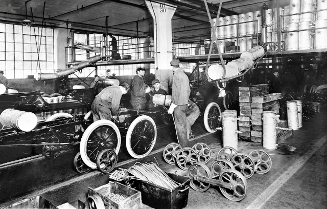 Ford makes first moving assembly line for cars