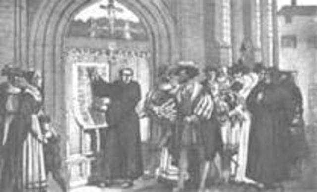 Martin Luther posts 95 theses on the door of the castle church