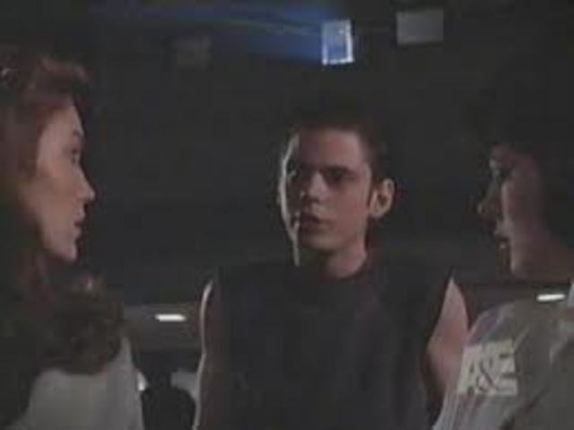 Ponyboy walks out of the movie house