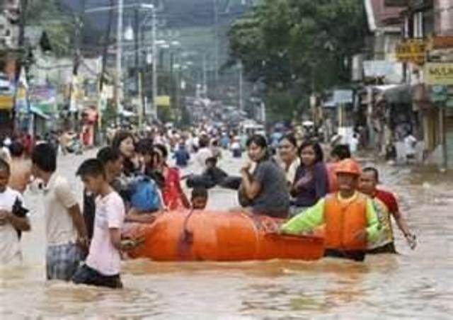 People living in Manila, Philippines, are forced to leave their homes due to heavy rainfall