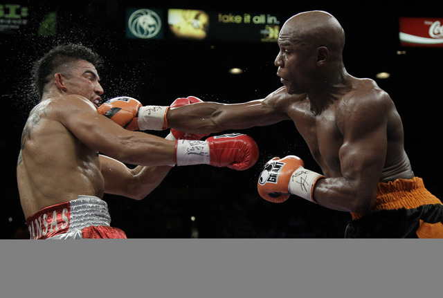 Wins WBC 130-pound title with an eighth-round TKO of Genaro Hernandez.