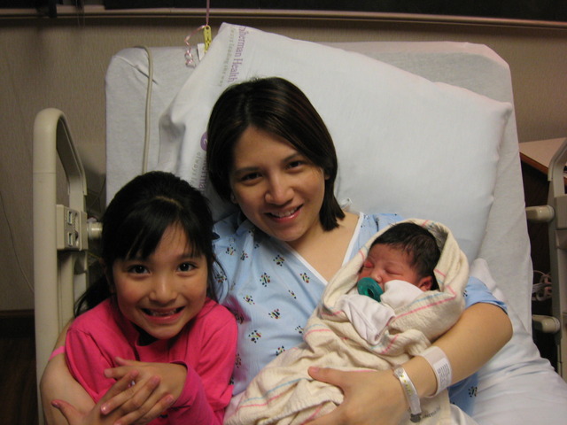 Visiting Moomy after Lauryn was born