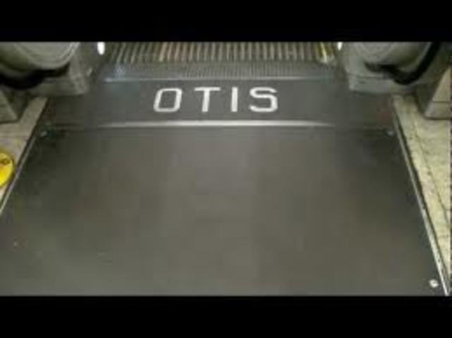 Otis's first step-type escalator made for public use, is installed at the Paris Exhibition