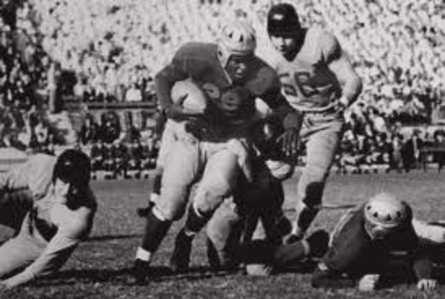 Plays football for the Honoulu Bears and leaves Pearl harbor on December 5th 1941 2 days before the attacks